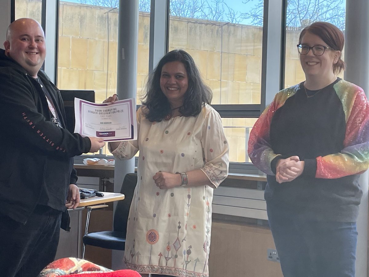 Rob Robinson receives the Yuan Changing Prize from Drs Radhika Govinda and Meryl Kenny.