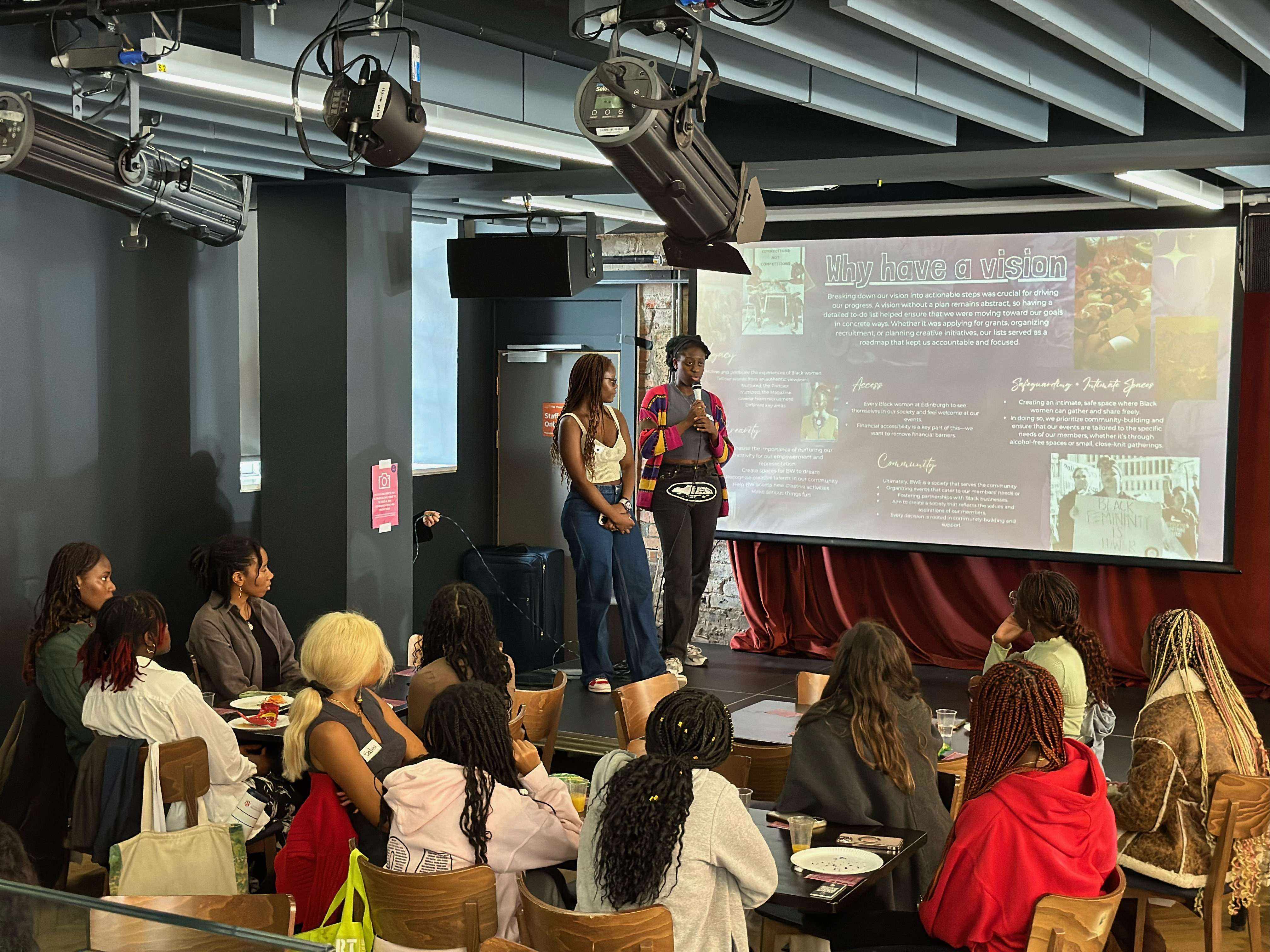 Rutendo and Claudia, President and Vice President of Black Women* at Edinburgh presenting at our first official event as a society in September 2024. Image credit: Katherina Alawode (2024)
