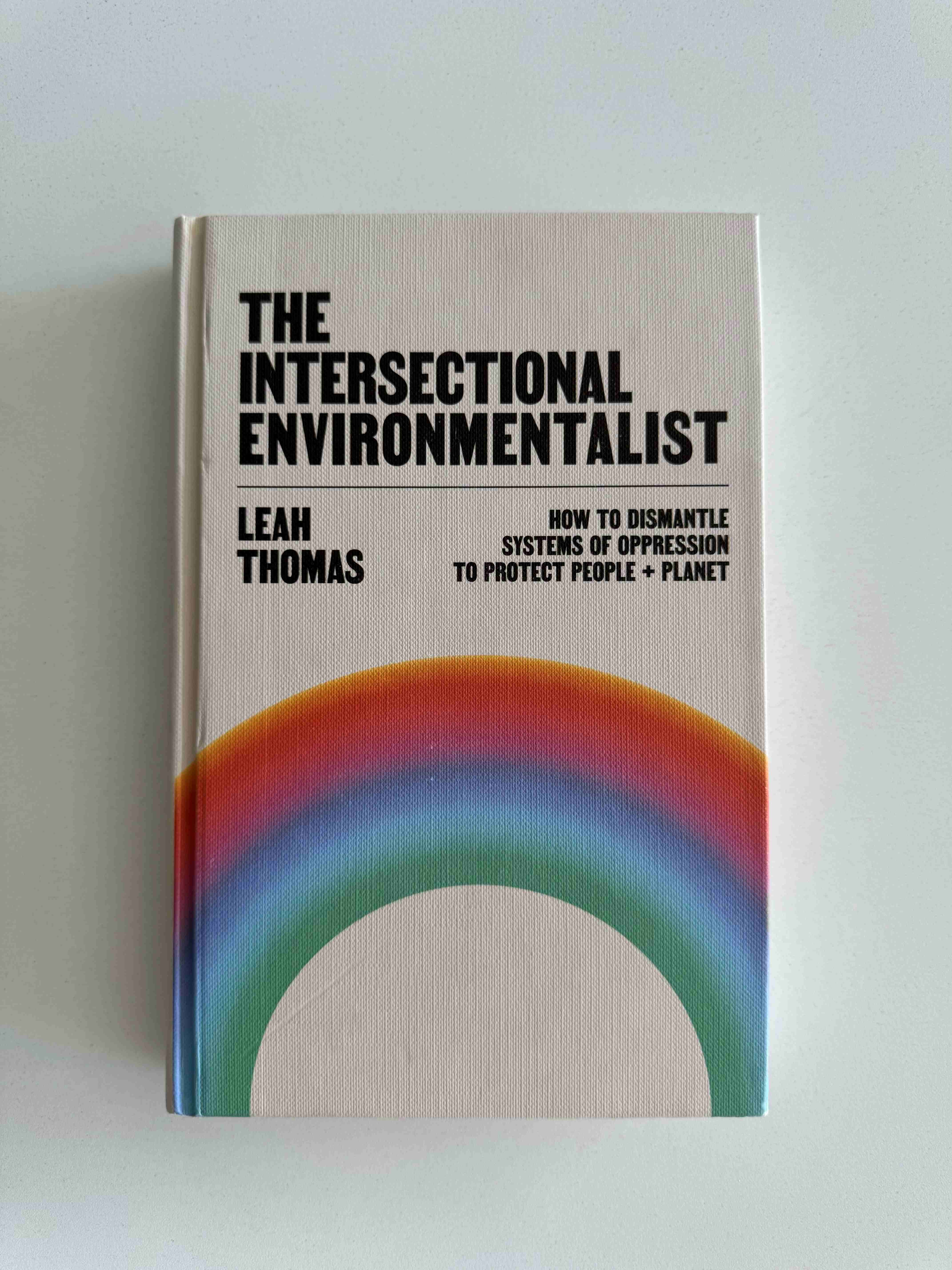 Photo of the front cover of Leah Thomas' book 'The Intersectional Environmentalist: How to Dismantle Systems of Oppression to Protect People + Planet'