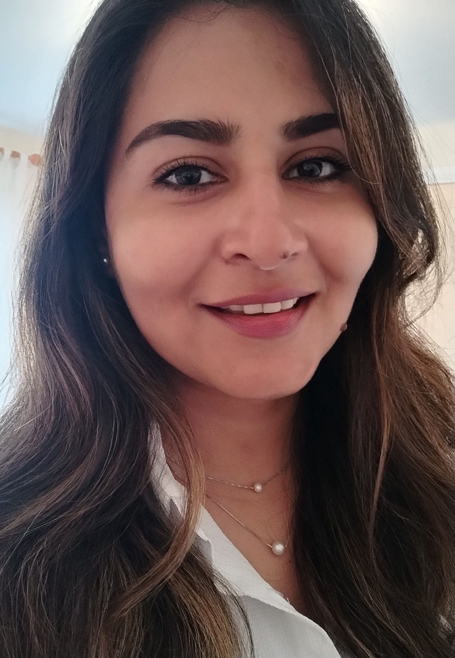 woman with long hair and a smile